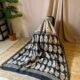 IMG_8414.JPG black & off-white Chanderi silk cotton saree with traditional handblock ajrakh paisley motifs